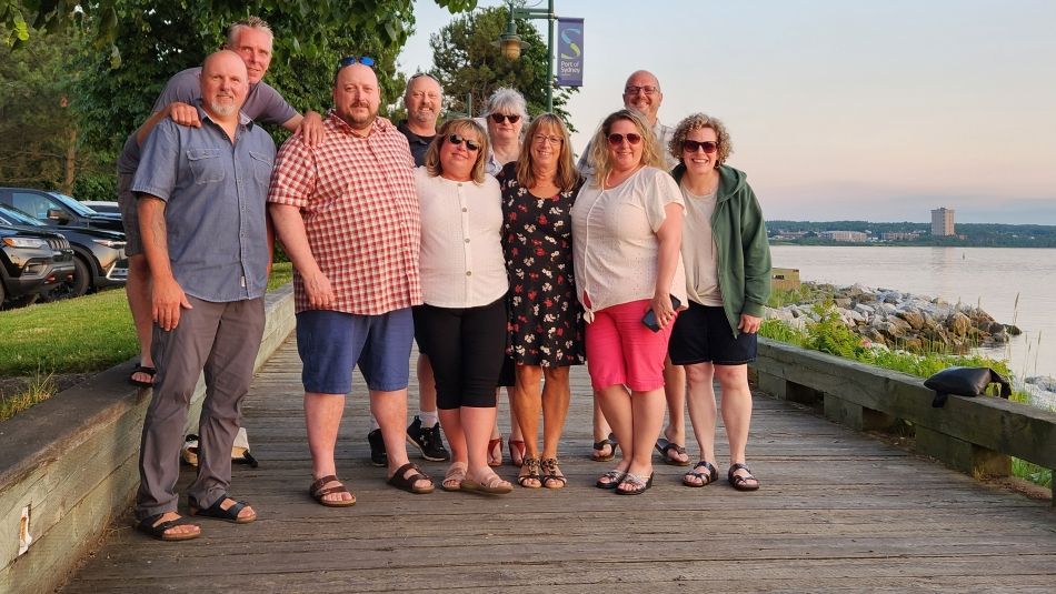 Group taking photo near water