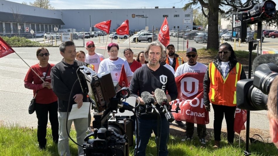 a group of people standing in front of a camera