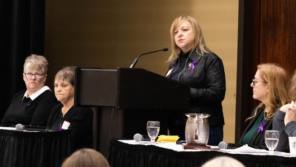 Jennifer Murray speaking at a podium