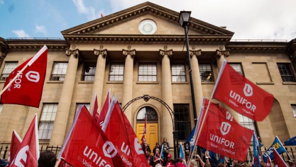 NS Bill 148 rally people waving Unifor flags outside NS legislature