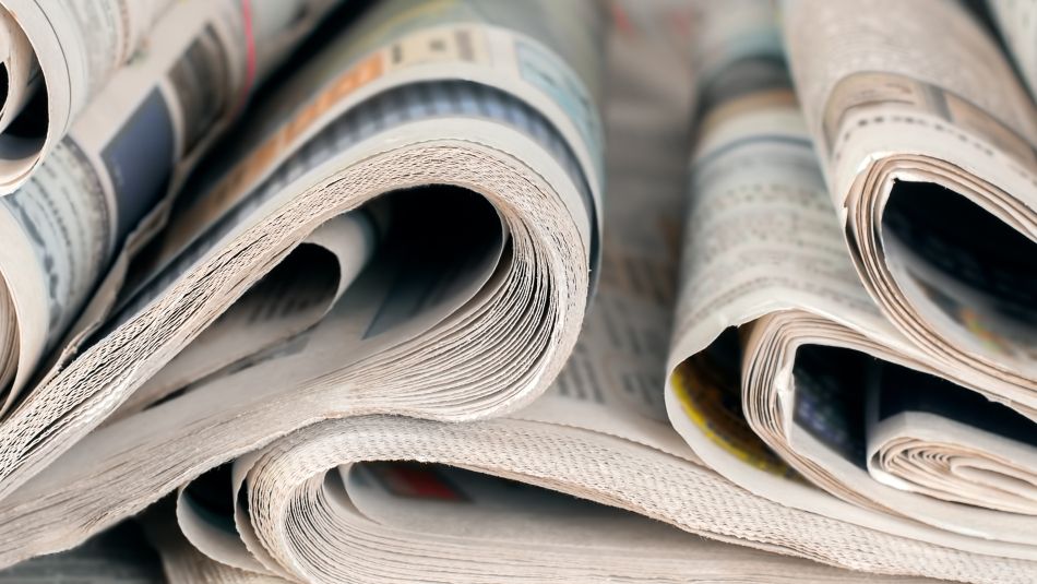 stack of rolled up newspapers