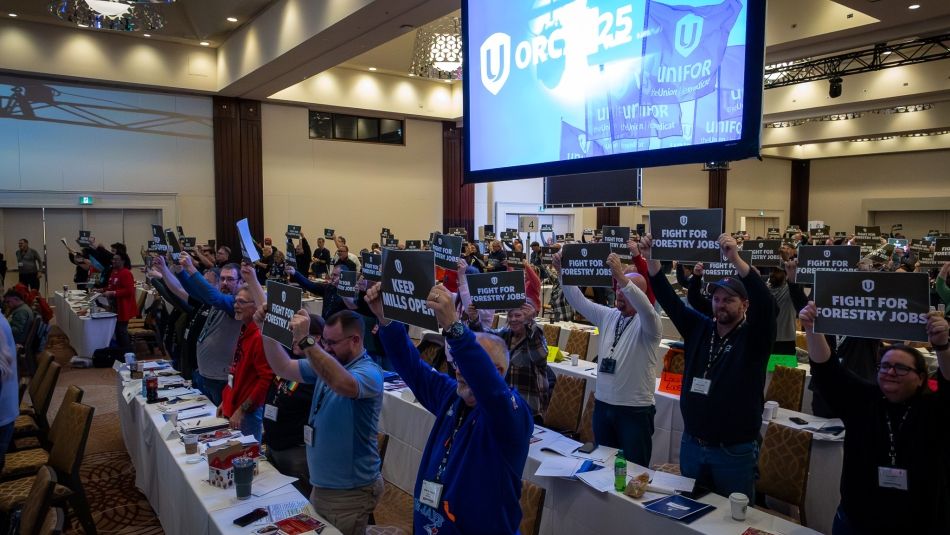 Conference room full of delegates and ORC on a screen hanging above.