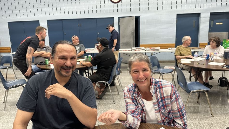 two people smiling at the camera at a BWP meeting in Oshawa.