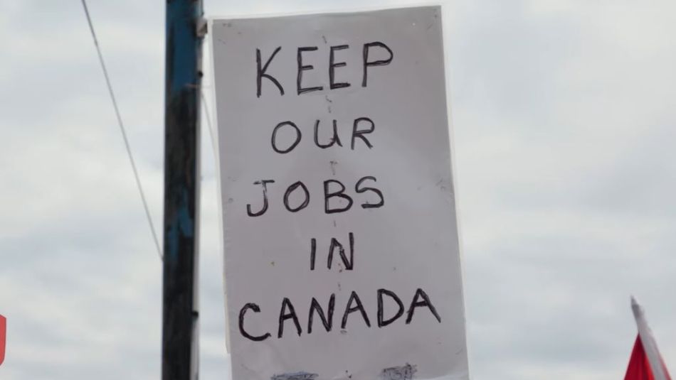sign reads "Keep our Jobs in Canada"