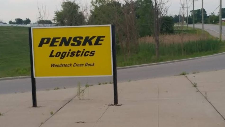 Penske Logistics exterior sign yellow with black writing