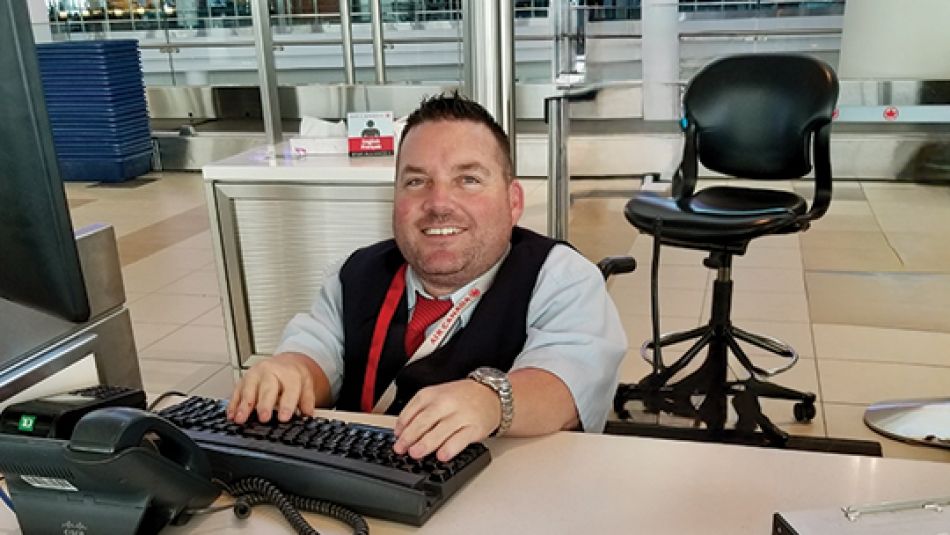a little person sitting at a desk, typing on a keyboard