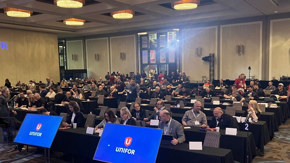 a room full of people sitting class room style looking to the font