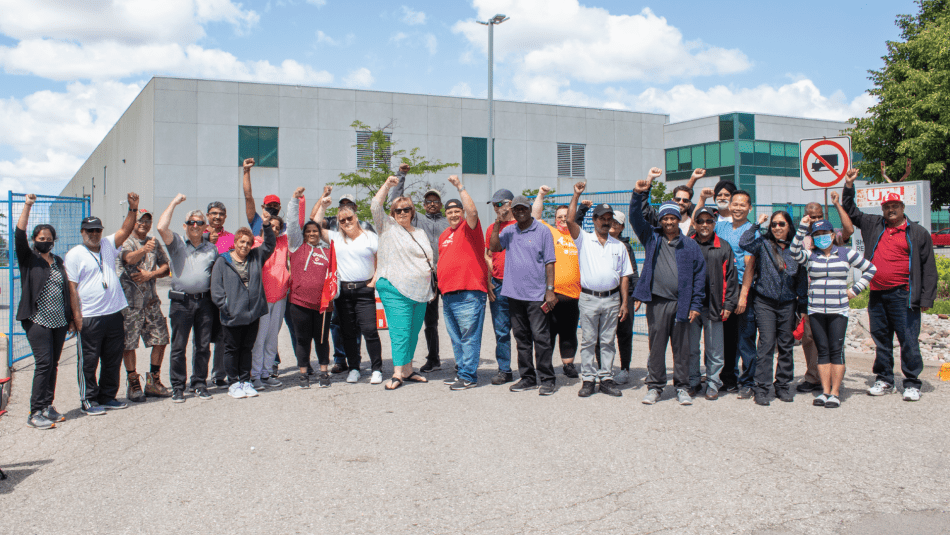 Unifor Local 112 members an supporters stand on the picket line in front of the UTIL auto parts plant in Concord, Ontario.