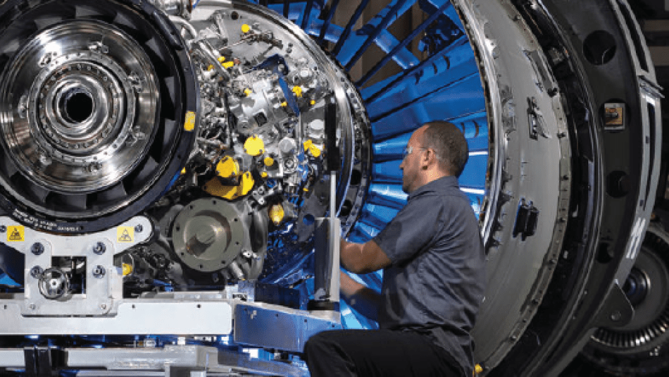Worker assembling a Pratt and Whitney engine at the Mirabel Airport facility.