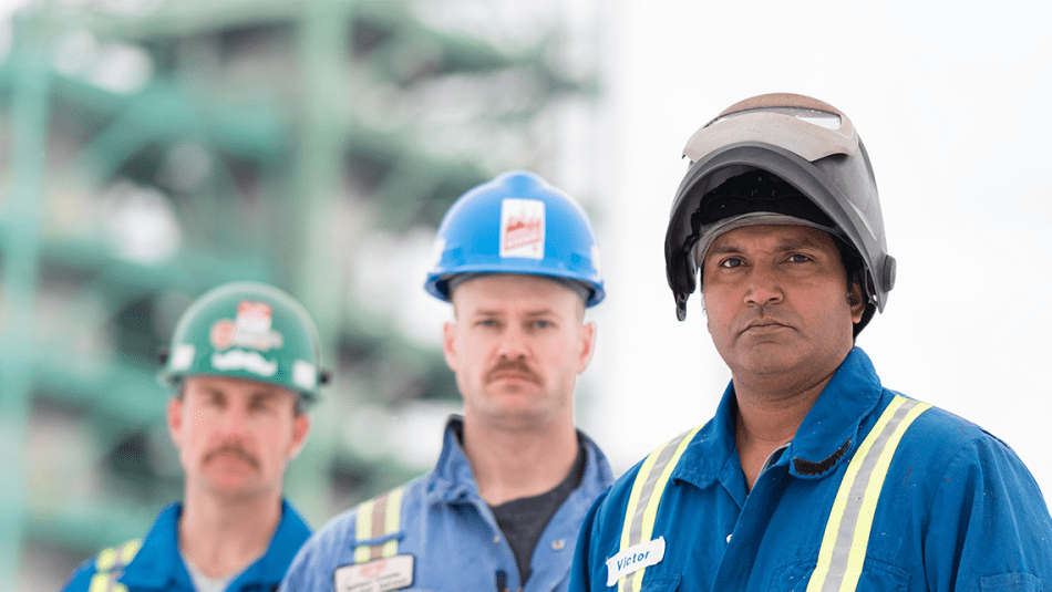 Three workers in PPE.
