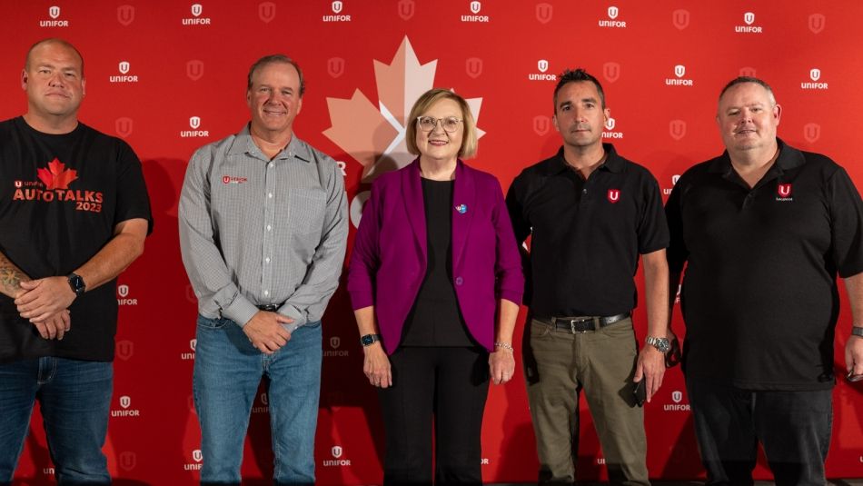 D3 Leadership standing in front of a Unifor backdrop