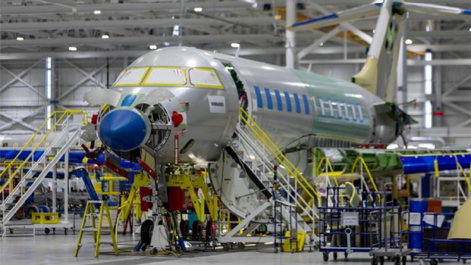 A plane being built in a factory