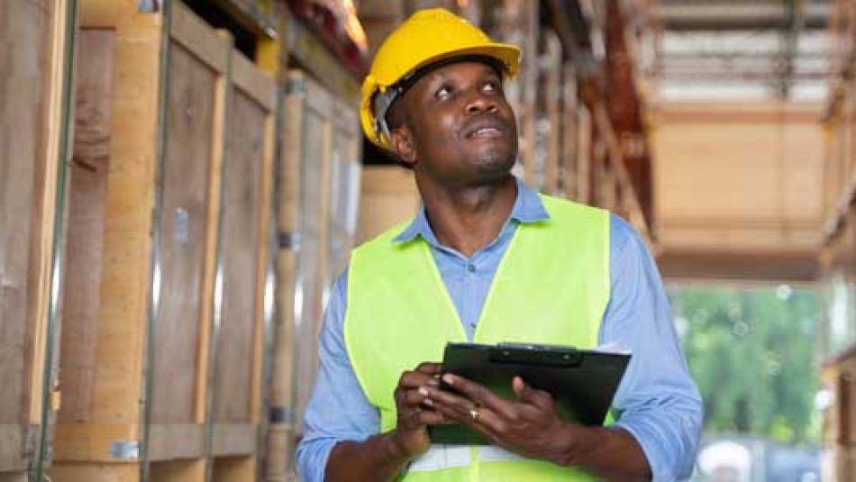 A photo from the Warehouse campaign shows a Black worker in a warehouse.