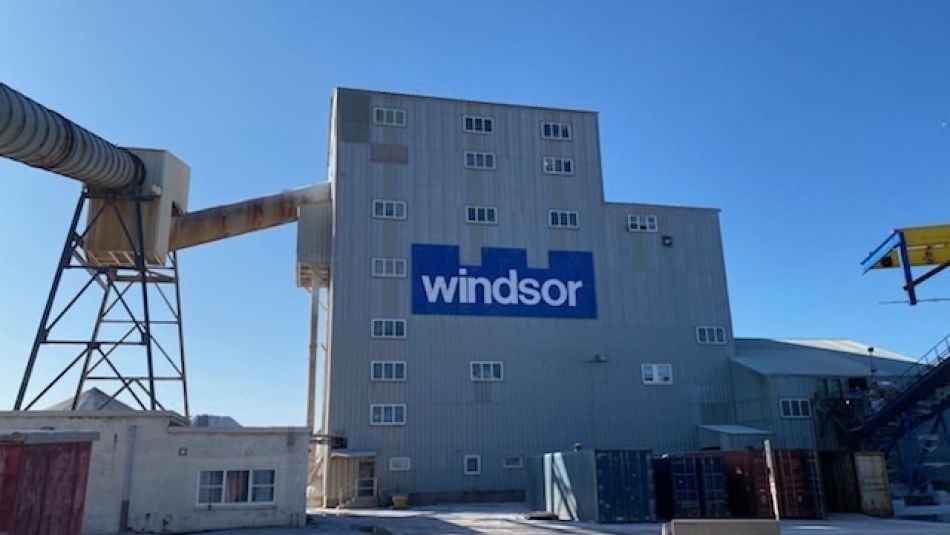 Large grey windowless industrial building with Windsor Salt signage