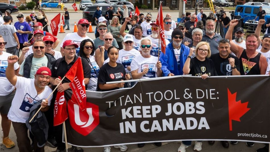 group of people holding rally banner 