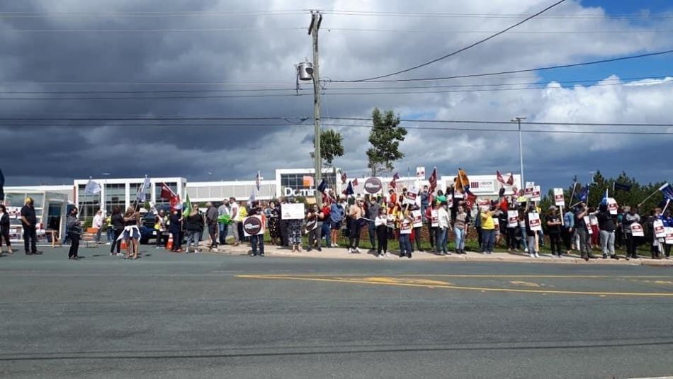 Members of Unifor Local 597 on a picket line at a Dominion store in Newfoundland.