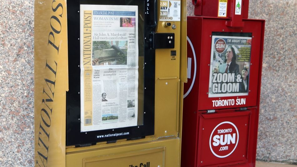 National Post and Toronto Sun newspaper boxes.