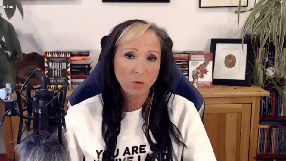 Screen capture of keynote speaker Pam Palmater in her office