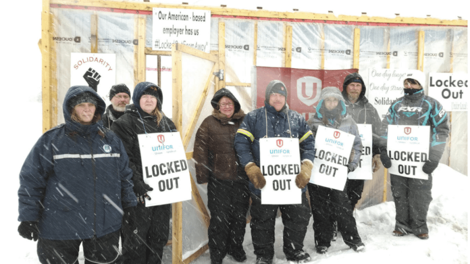 Locked-out Unifor members on a picket line.