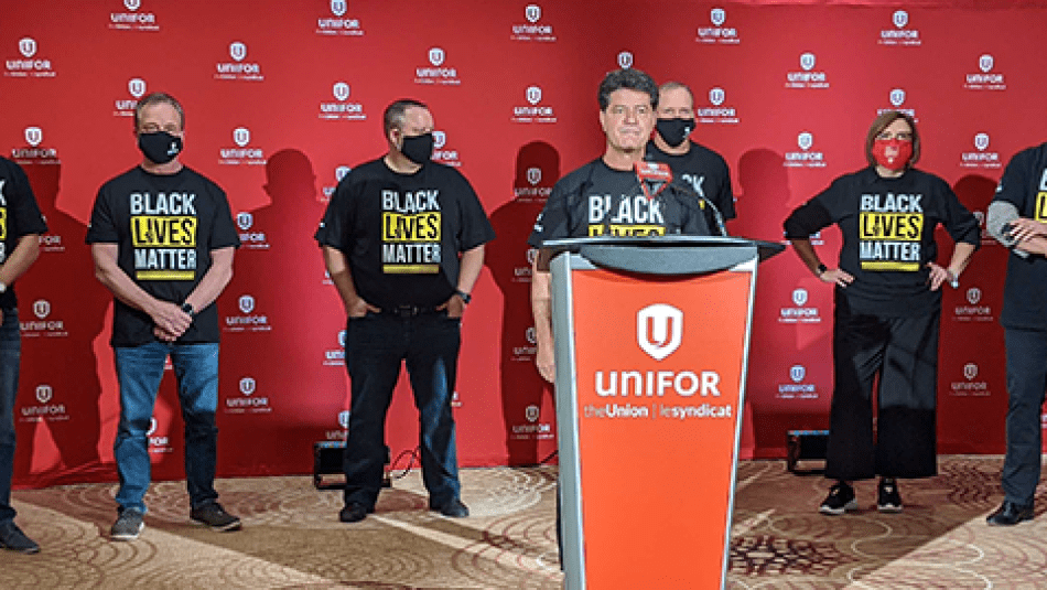 Jerry Dias and Unifor's Master Bargaining Committee at a press conference.
