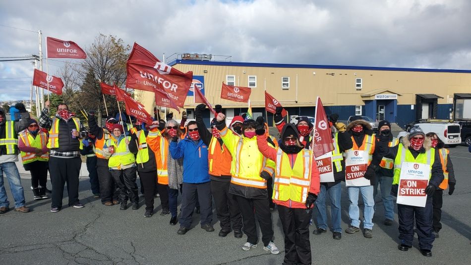 Chris MacDonald and members of Unifor Local 597 on a picket line.