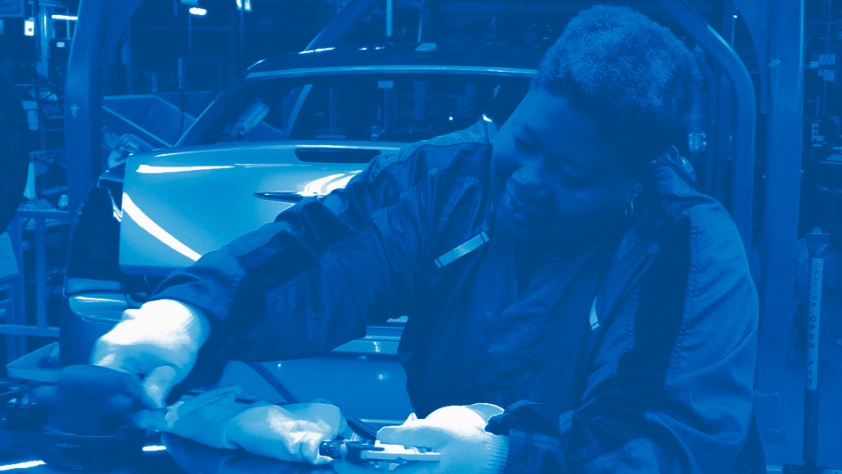 An autoworker on an assembly line.