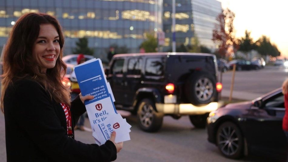 A Unifor member in a parking lot.