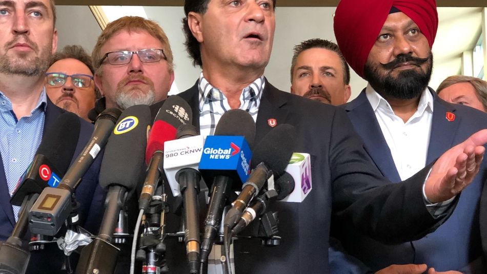 Jerry Dias speaks to a media scrum.