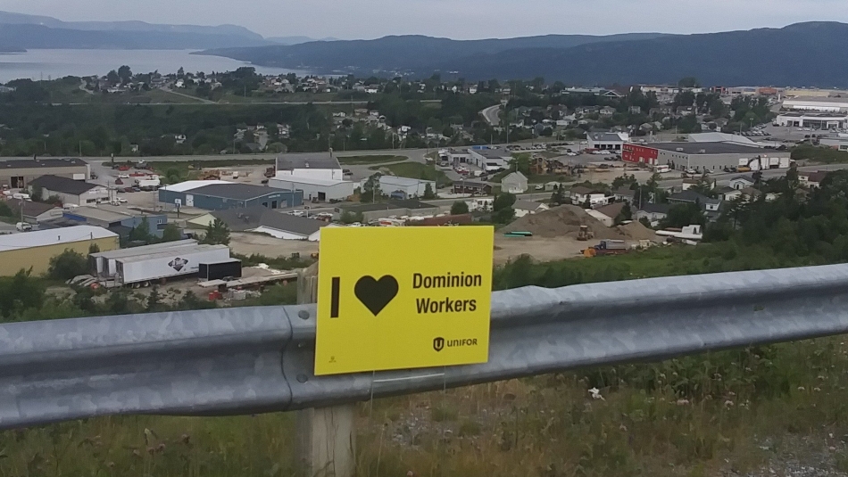 An "I love Dominion workers" on a guardrail overlooking St-John's, Newfoundland.