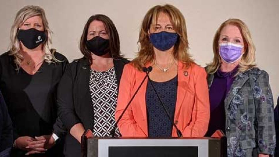 Katha Fortier with representatives from other health care unions at a press conference.