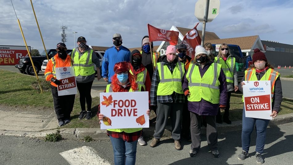 Members of Unifor Local 597 hold a food drive while on strike.