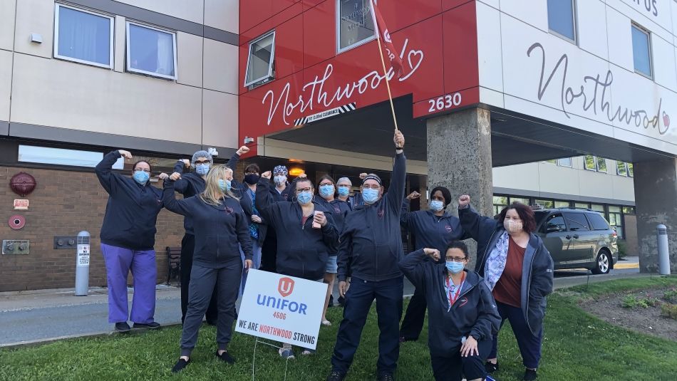 Northwood employees with masks outside of the long-term care facility 