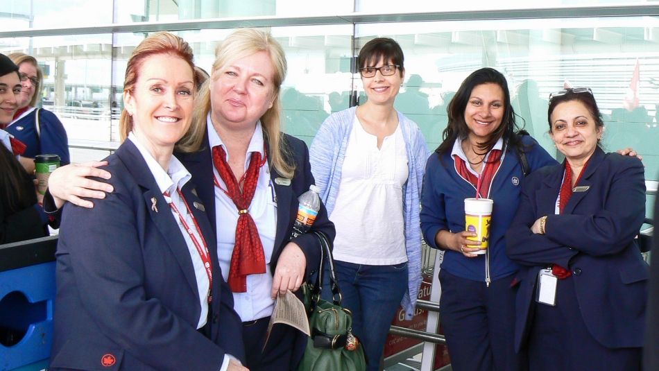 Group shot of women Air Canada workers in uniform.