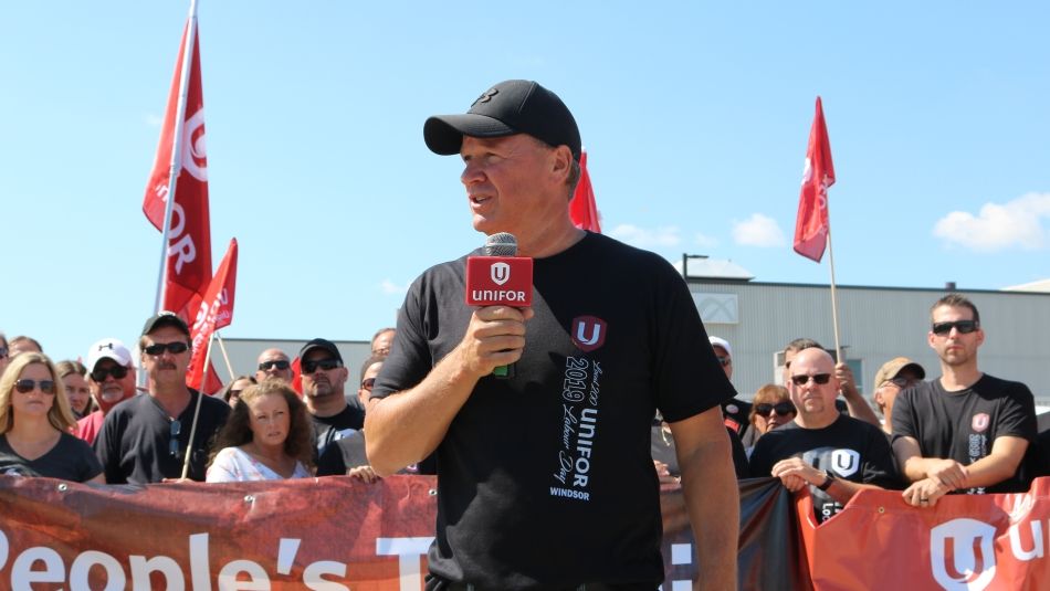 Unifor Local 200 president John D'Agnolo speaks to a crowd.