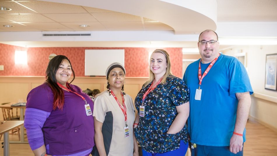 Four Northwood healthcare workers standing together.