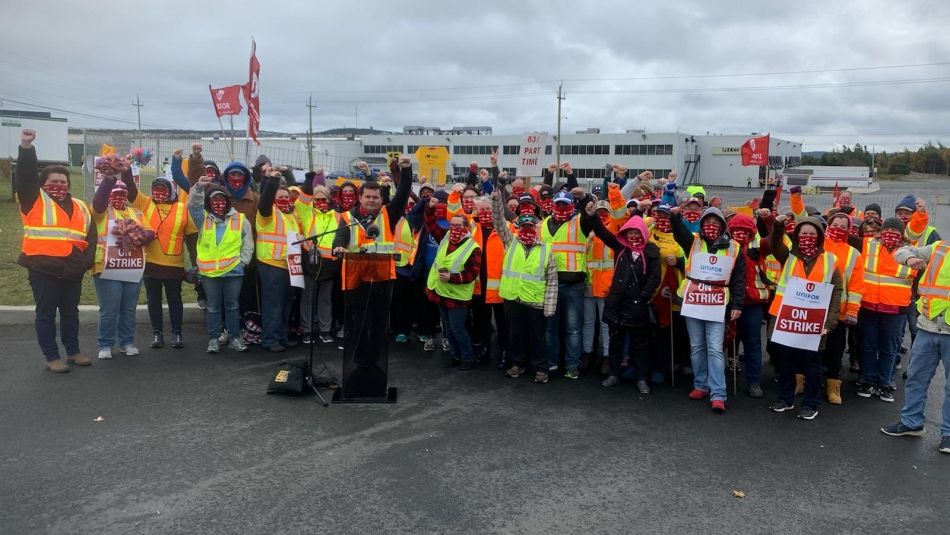Chris MacDonald and members of Unifor Local 597 on a picket line.