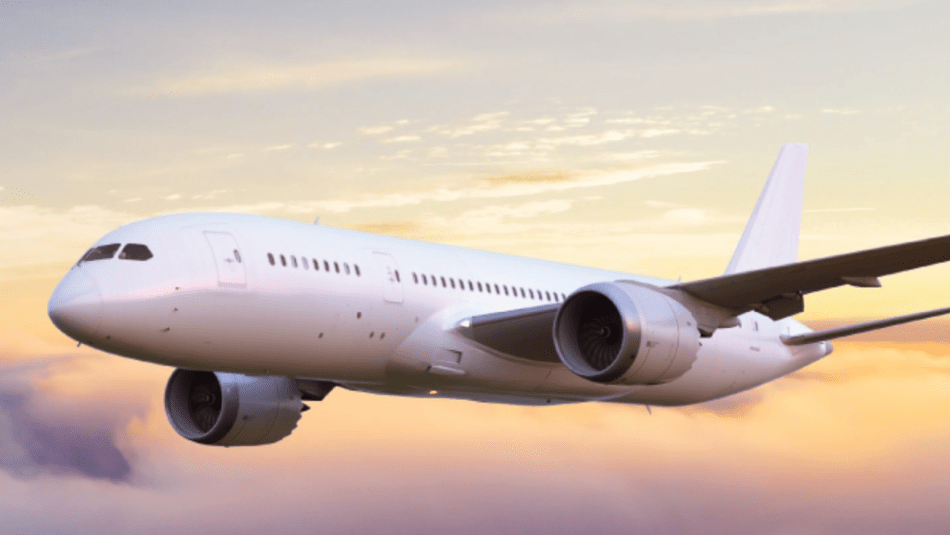 Photo of passenger jet above the clouds at dusk