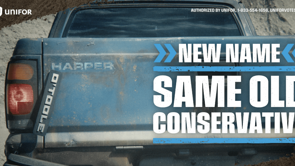 rear bumber o old pickup truck with O'toole label falling off, revealing faded Harper label