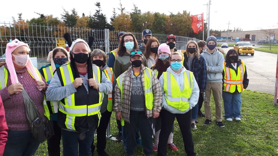 Striking members of Unifor Local 597 on a picket line.