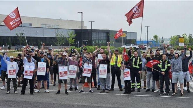 A large group holding up flags
