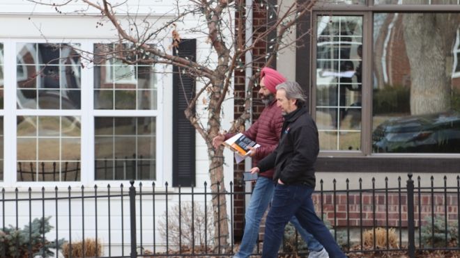 Two men walking down the street