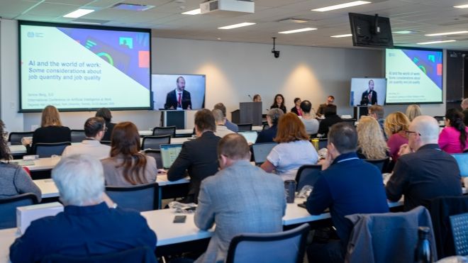 A conference room including participants of the AI at Work conference.