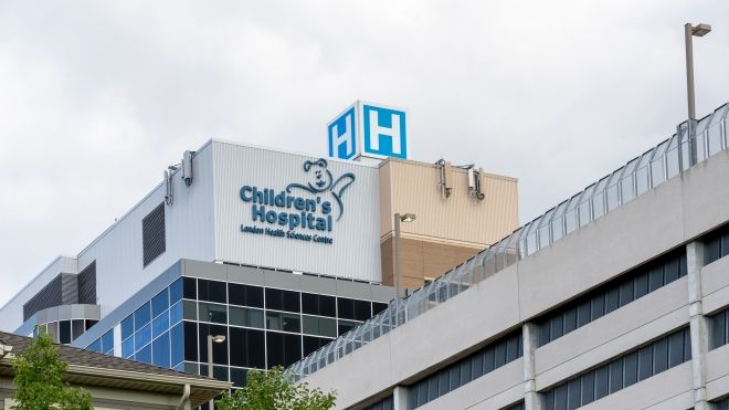 Exterior photo of London Health Sciences Centre featuring teddy bare sign beside the words "Children's Hospital"