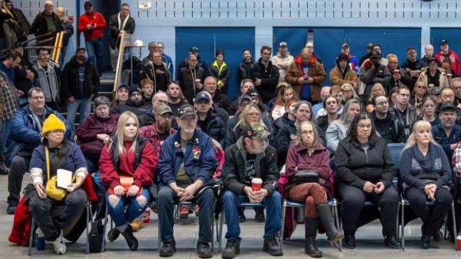 Unifor members seated in a meeting hall