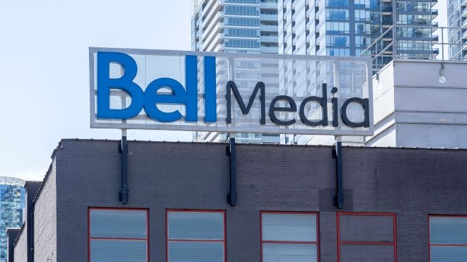 A blue Bell Media sign atop a building.