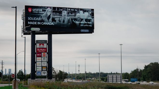 A billboard that reads: Unifor - Solidarity. Made in Canada.