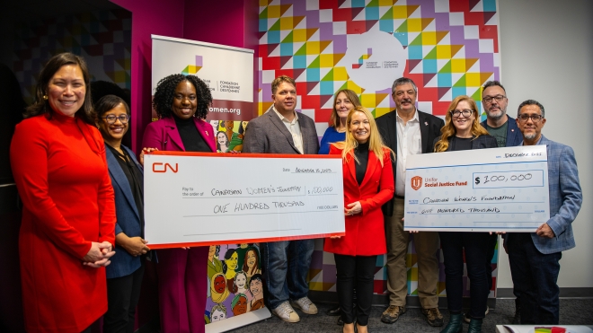 A group of people presenting a cheque from the Unifor Social Justice Fund and CN to the Canadian Women's Foundation