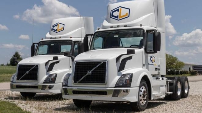 Two semi trucks parked in a row