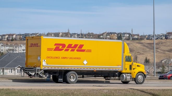 A DHL semi truck in a suburban area