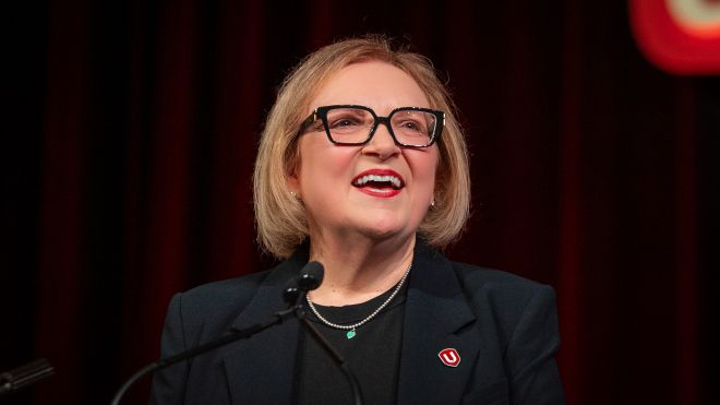 A women speaks at a mic